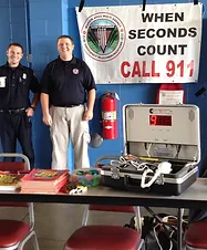 Two paramedics with emergency equipment and a "When Seconds Count Call 911" banner.