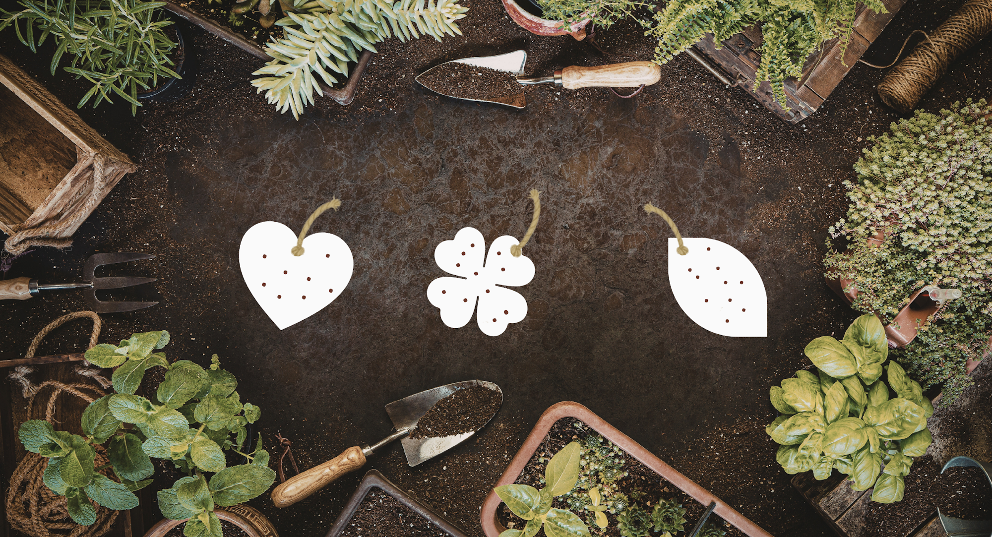 The image shows a gardening scene with tools, plants, and illustrated tags in shapes of a heart, clover, and leaf.