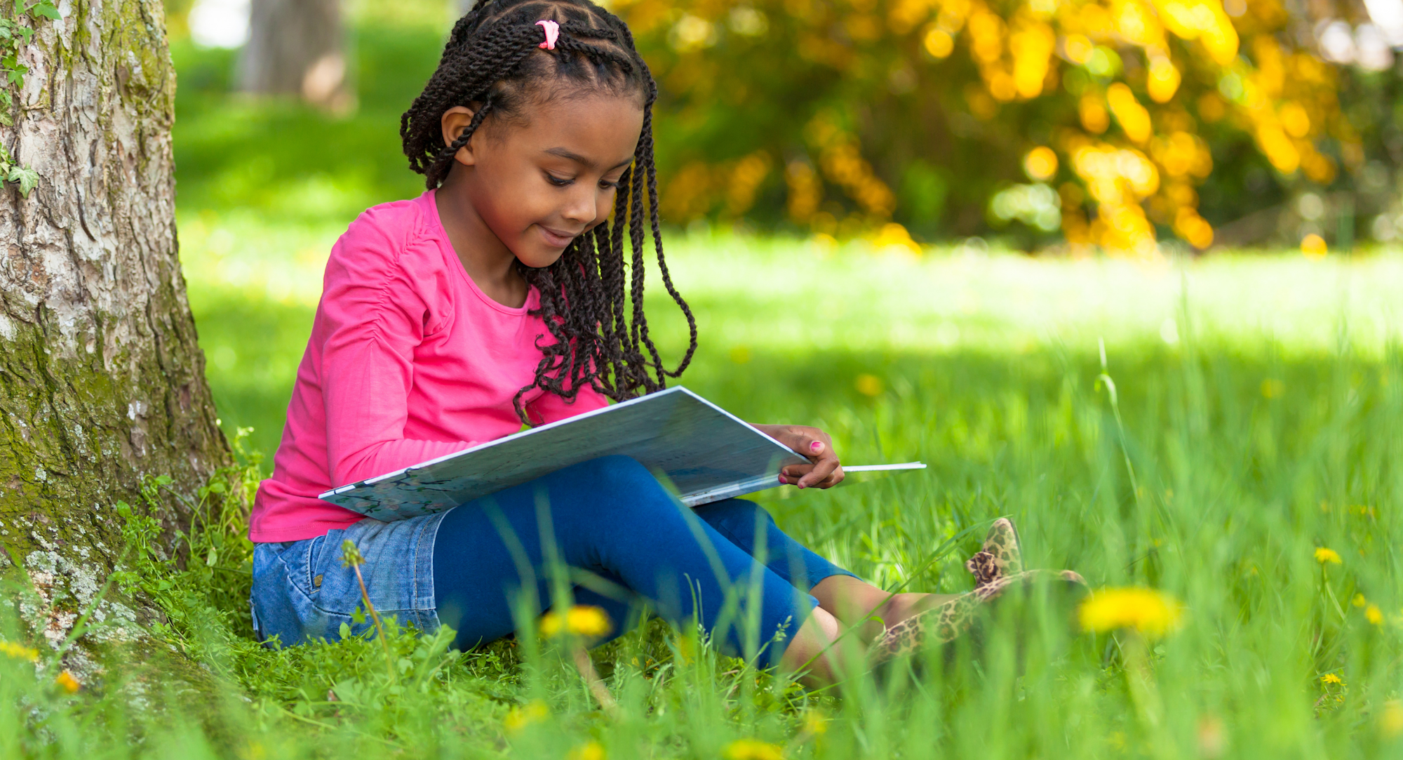 May contain: person, reading, sitting, child, female, and girl