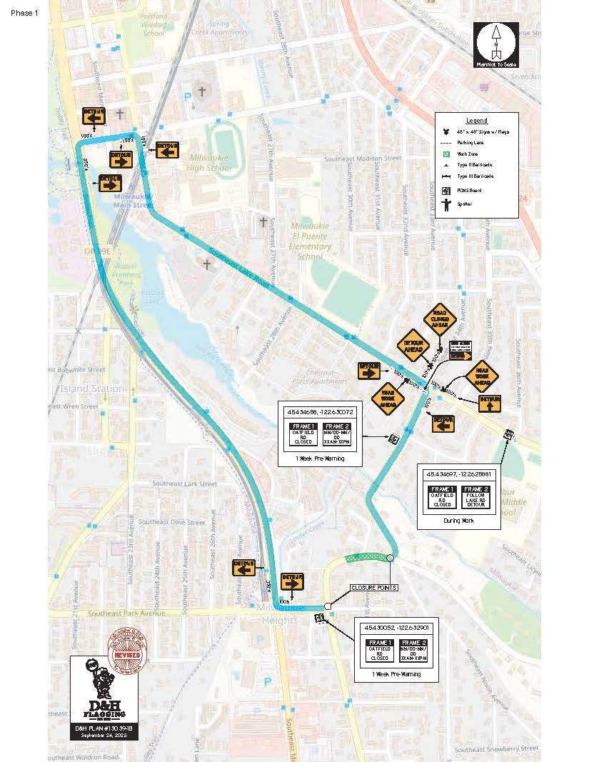 Map showing a construction detour route with signs and closure points in a city area.