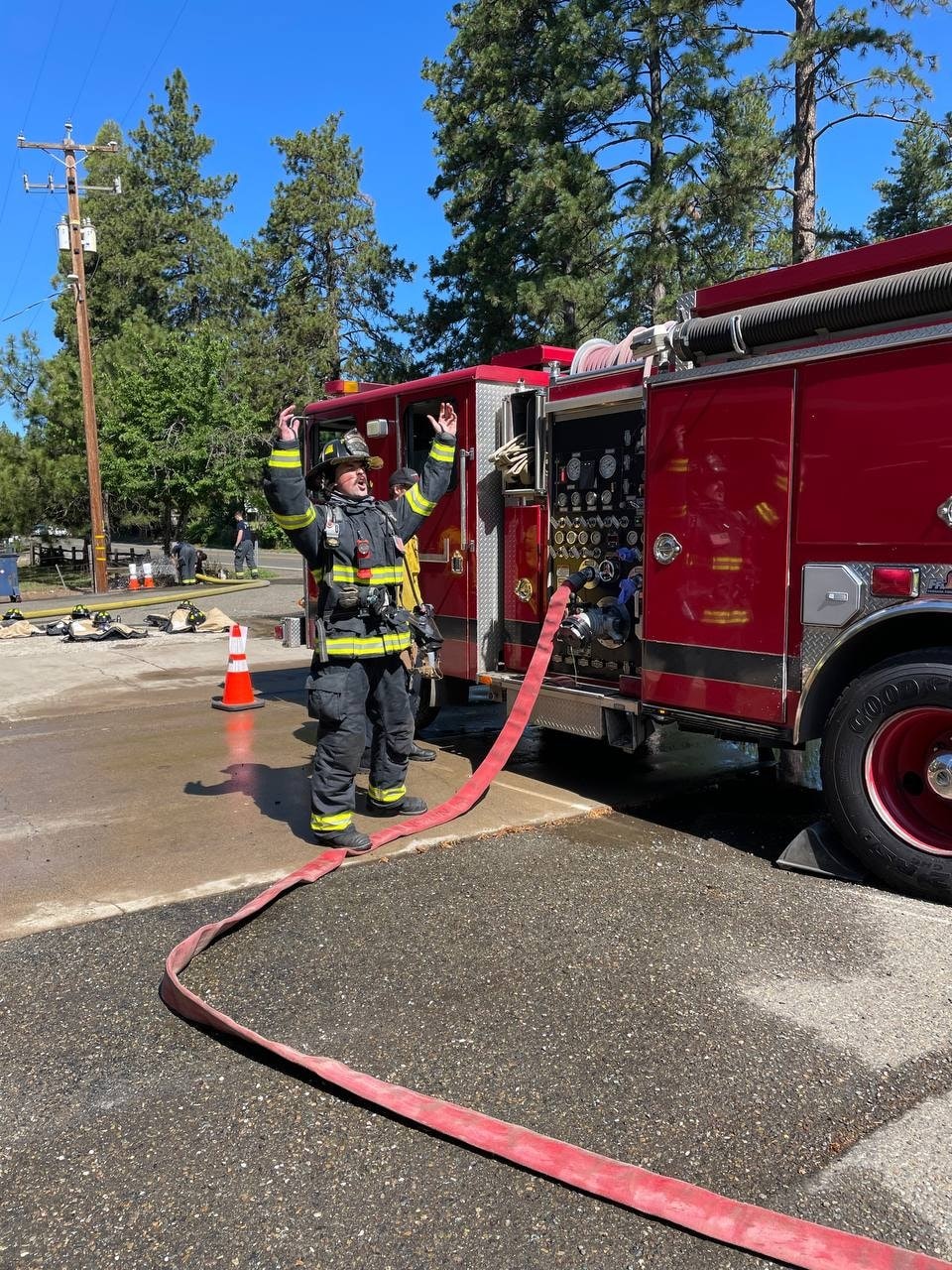 May contain: person, human, fire truck, transportation, vehicle, and truck