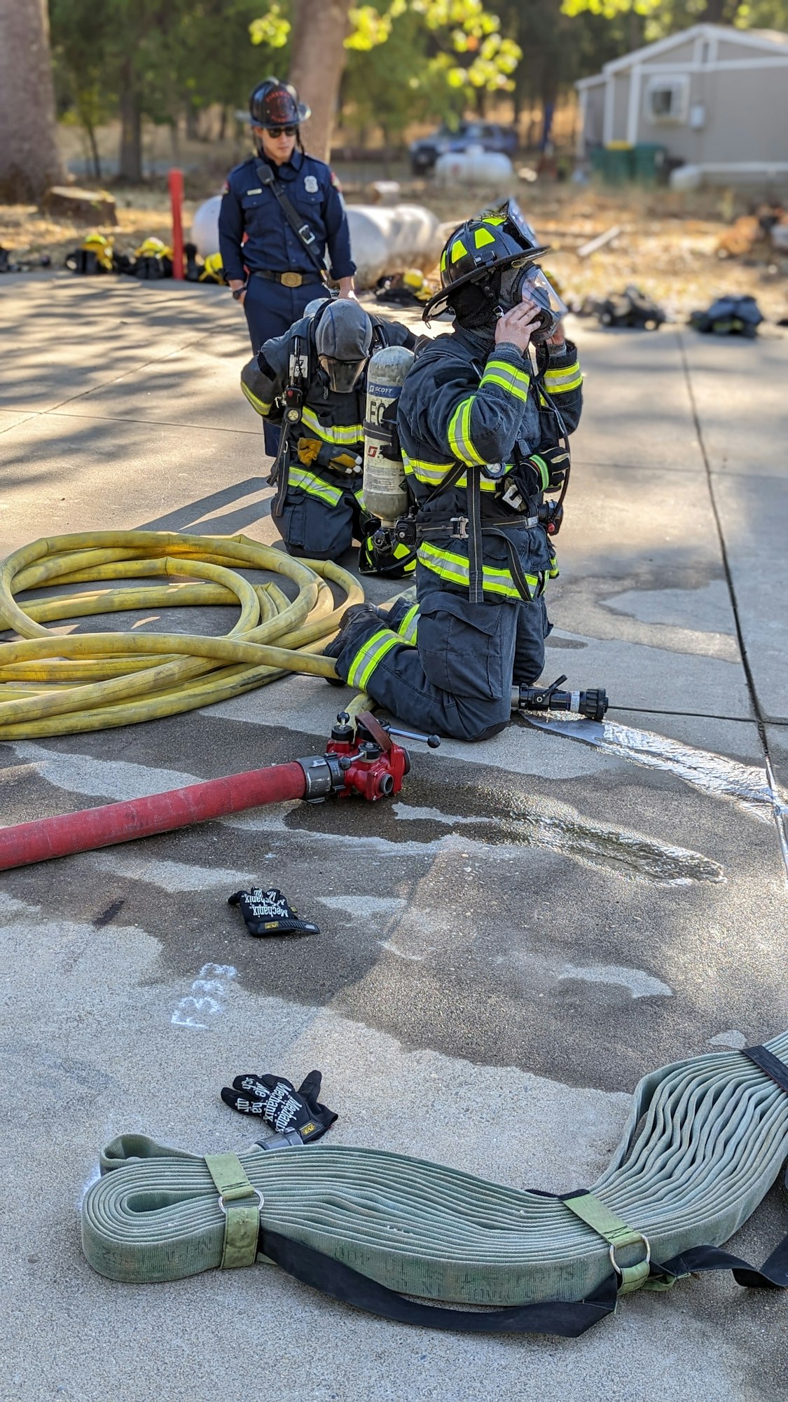 May contain: person, human, fireman, helmet, clothing, and apparel