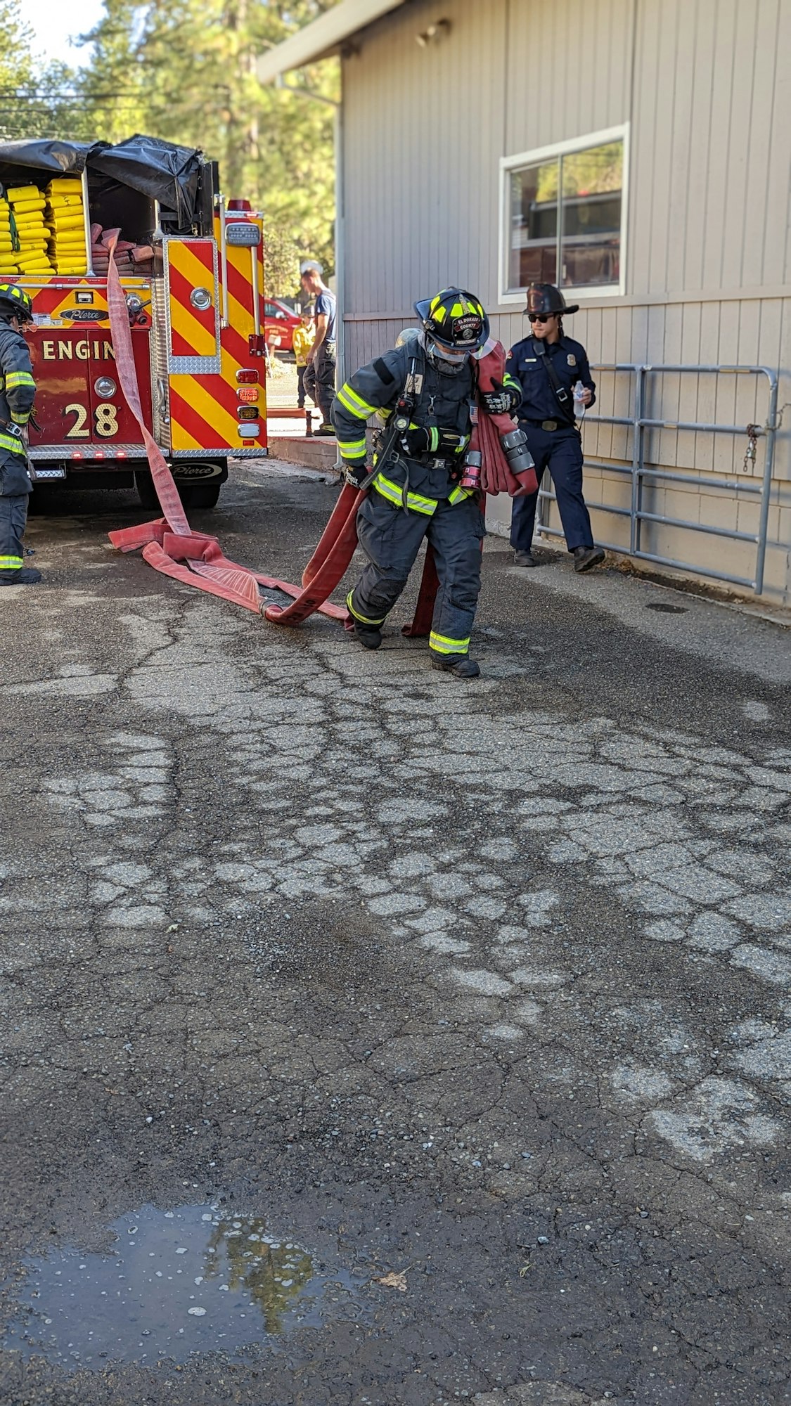 May contain: person, human, helmet, clothing, apparel, fireman, shoe, and footwear