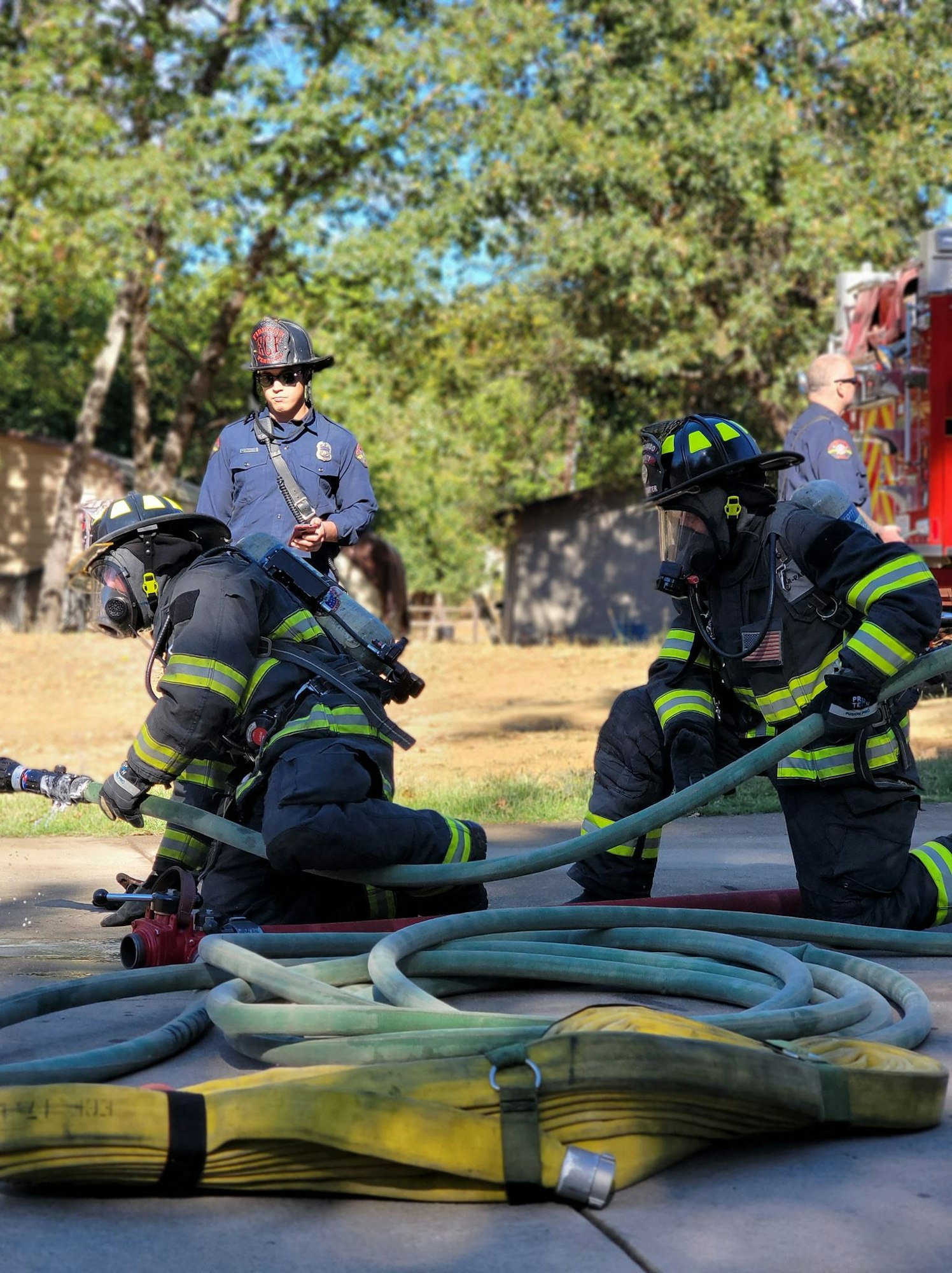 May contain: person, human, fireman, helmet, clothing, and apparel