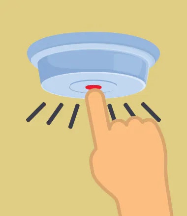 A hand pushing a button on a smoke detector.