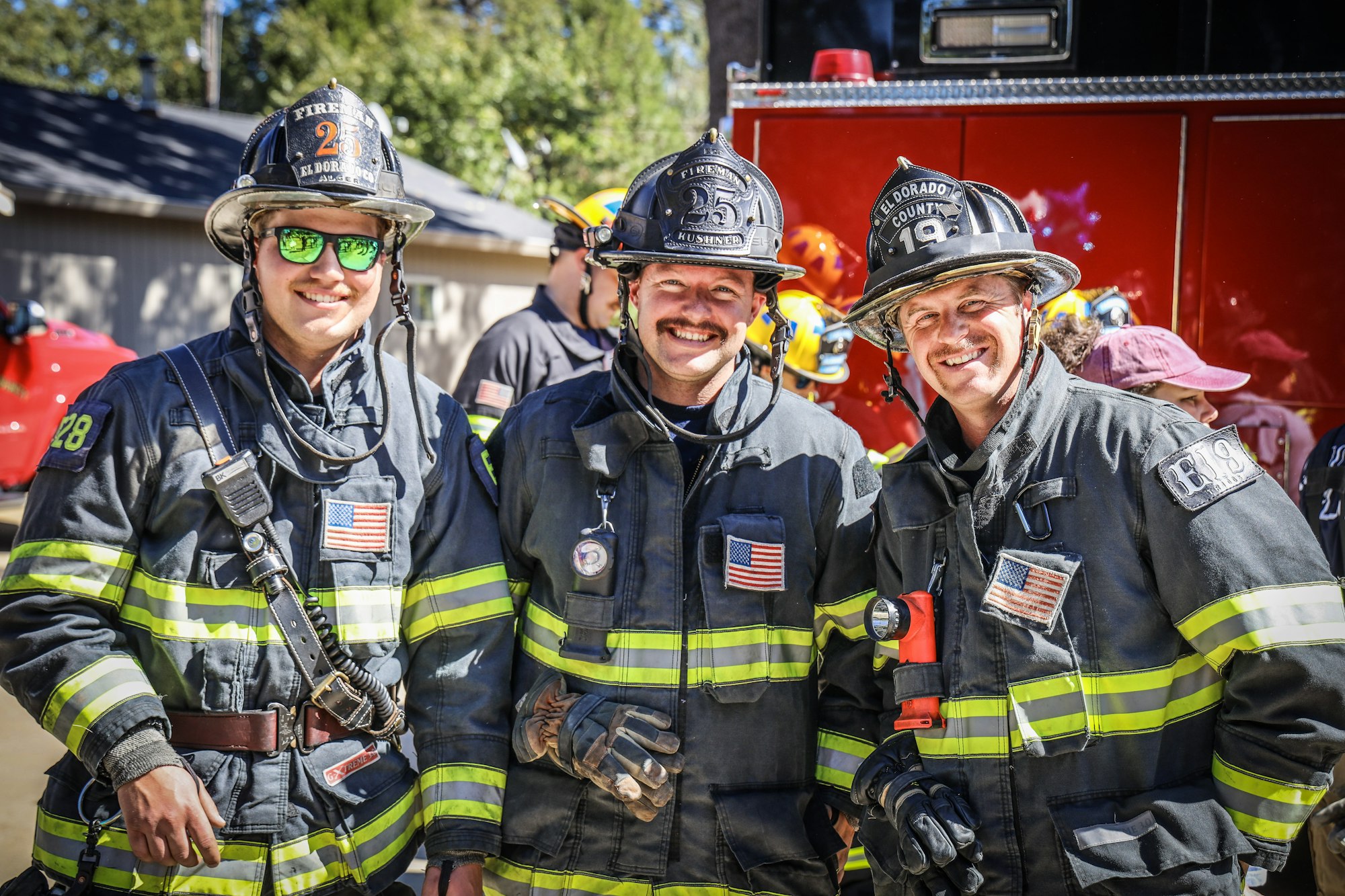 May contain: helmet, person, accessories, glasses, adult, male, man, fireman, car, transportation, vehicle, clothing, and glove