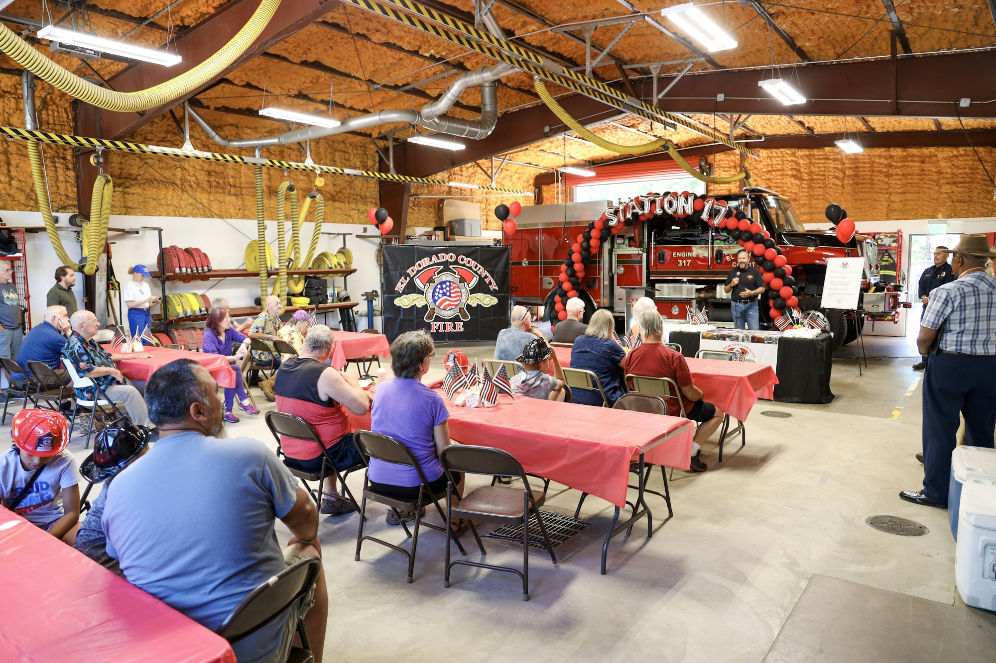 May contain: indoors, restaurant, cafeteria, helmet, food, food court, adult, male, man, person, clothing, footwear, shoe, chair, furniture, lamp, architecture, building, factory, hat, accessories, glasses, balloon, bag, and handbag