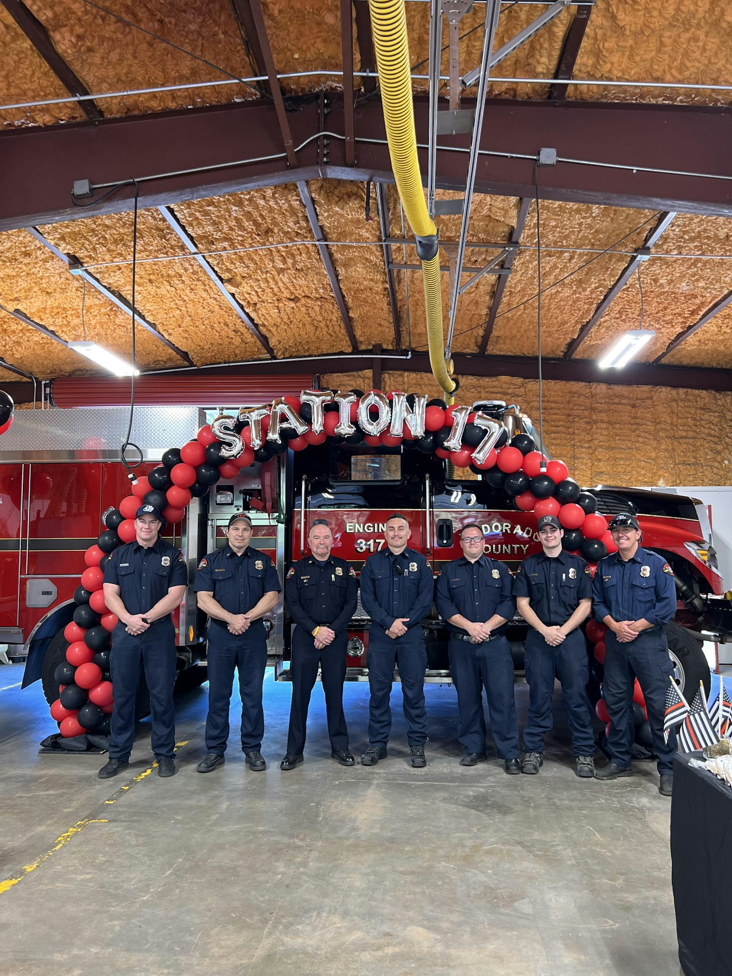 May contain: clothing, footwear, shoe, adult, male, man, person, accessories, glasses, hat, wristwatch, people, transportation, vehicle, fire station, fire truck, and truck