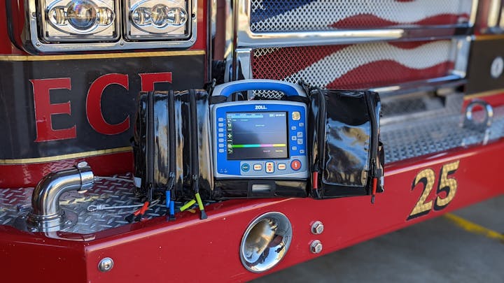 Contains red fire engine bumper, headlights and chrome, monitor defibrillator blue with black fabric case