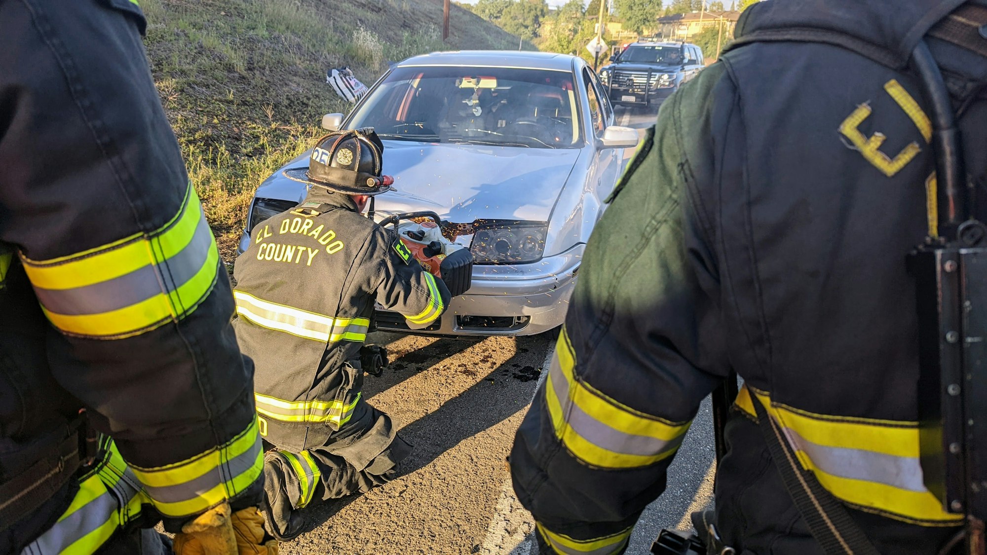 May contain: person, human, fireman, car, transportation, vehicle, and automobile