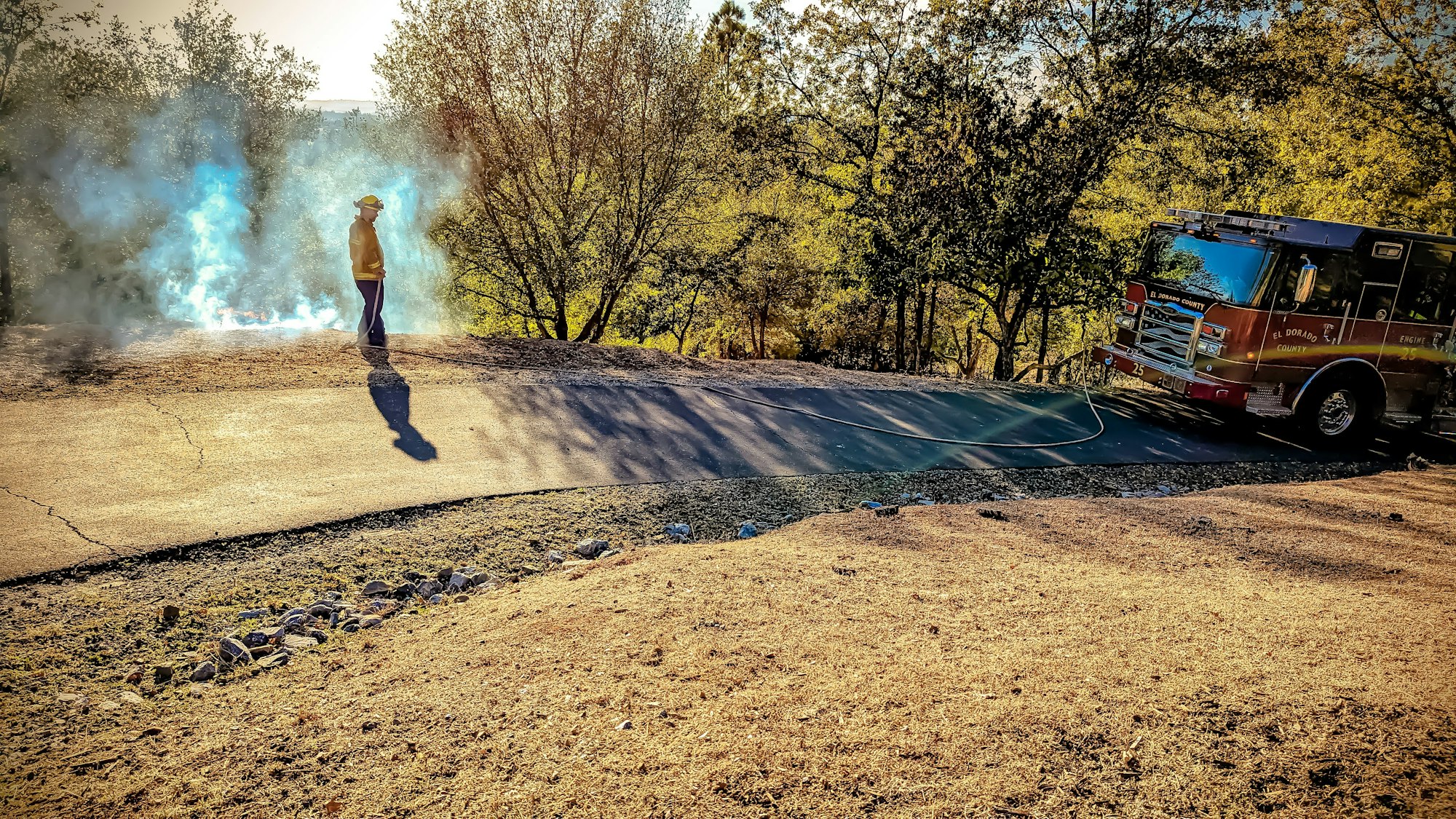 May contain: gravel, dirt road, road, ground, person, and human