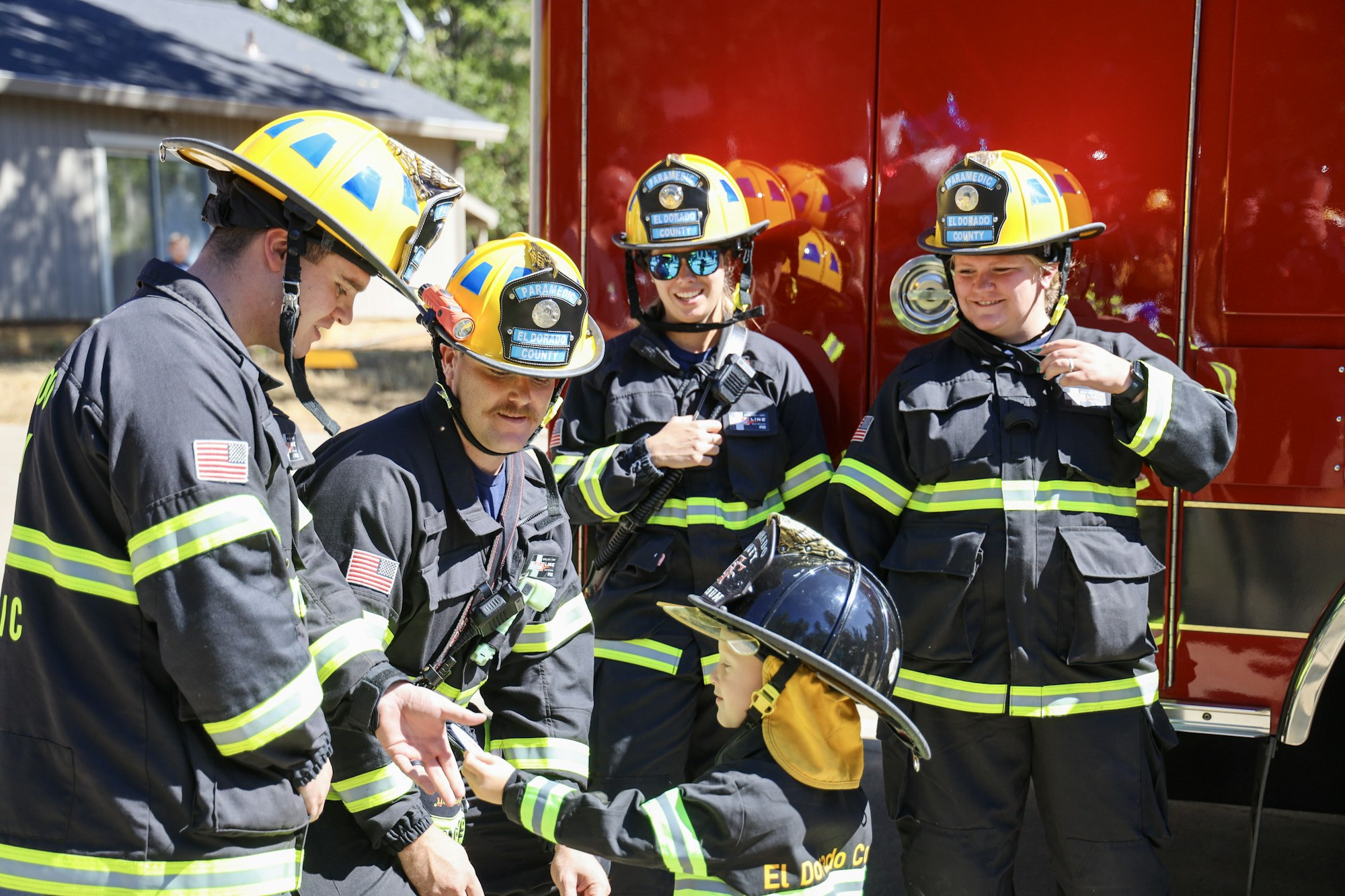 May contain: helmet, person, adult, male, man, accessories, glasses, wristwatch, and fireman