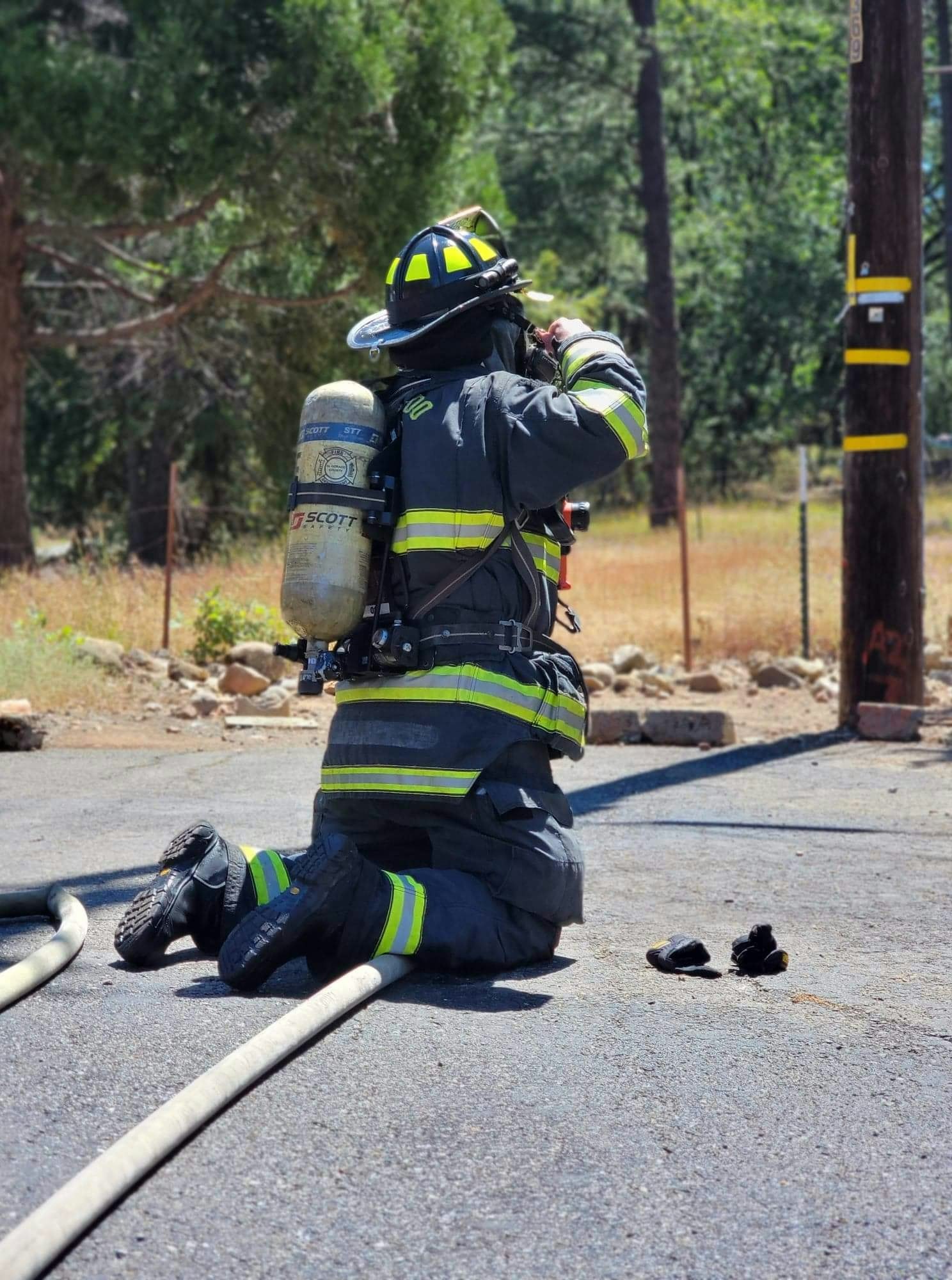 May contain: helmet, clothing, apparel, person, human, and fireman
