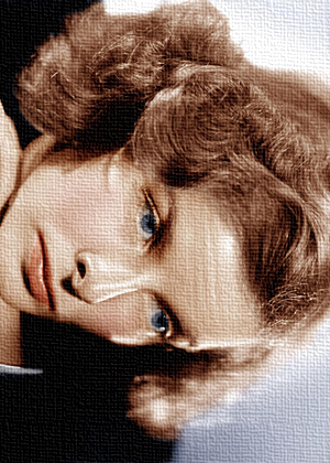 A close-up of a woman with curly hair, looking to the side, on a textured background.