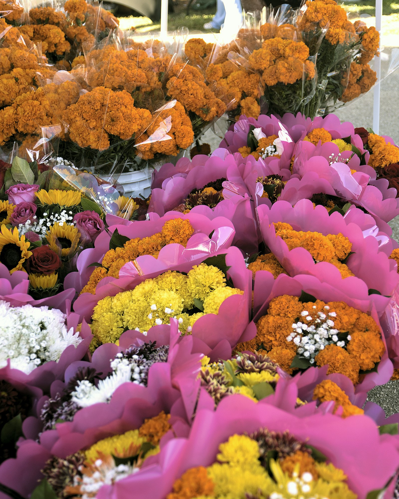May contain: flower arrangement, flower bouquet, flower, plant, petal, daisy, and person