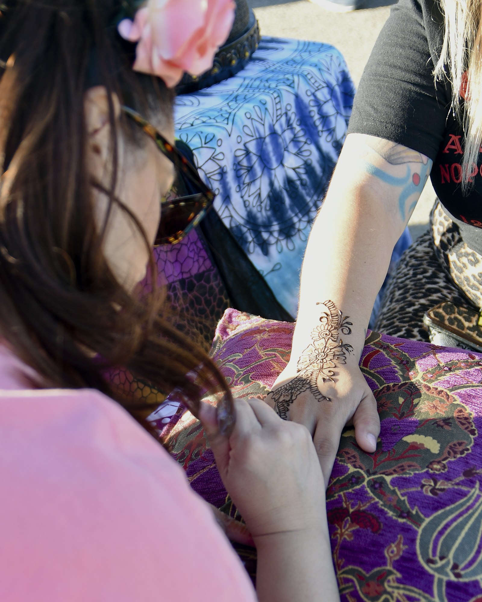 May contain: tattoo, skin, person, finger, hand, body part, glasses, and accessories
