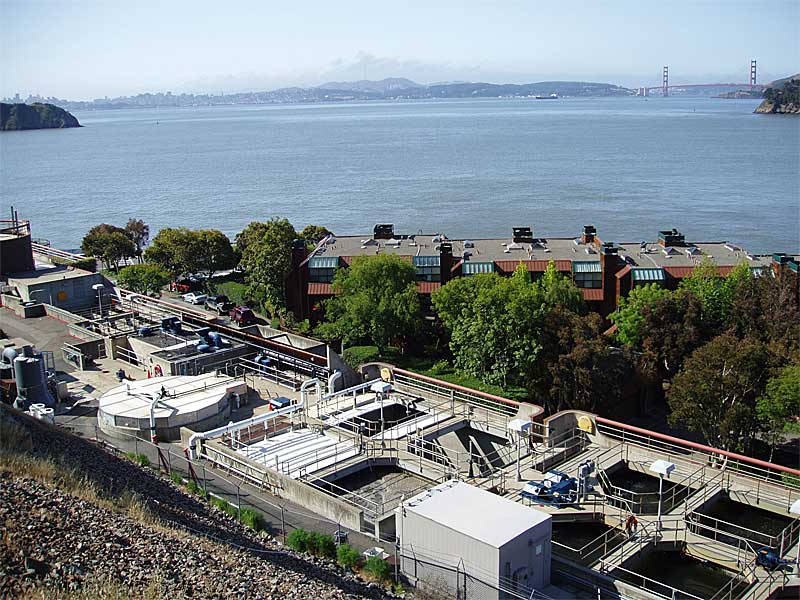 Photo of rooftops and San Francisco Bay