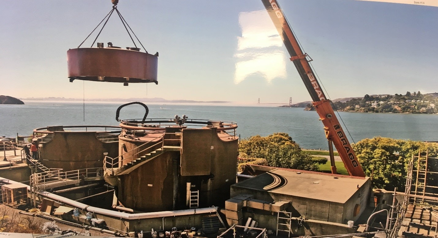 May contain: water, waterfront, construction, construction crane, nature, outdoors, scenery, port, boat, transportation, vehicle, and person