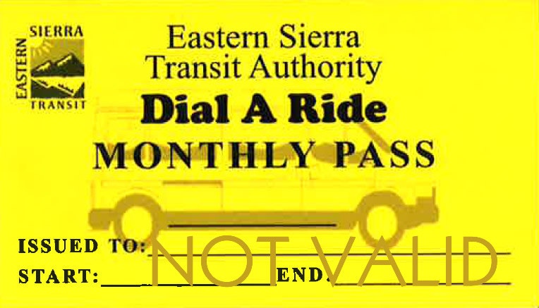A yellow Eastern Sierra Transit Authority "Dial A Ride Monthly Pass" with "NOT VALID" stamped across.