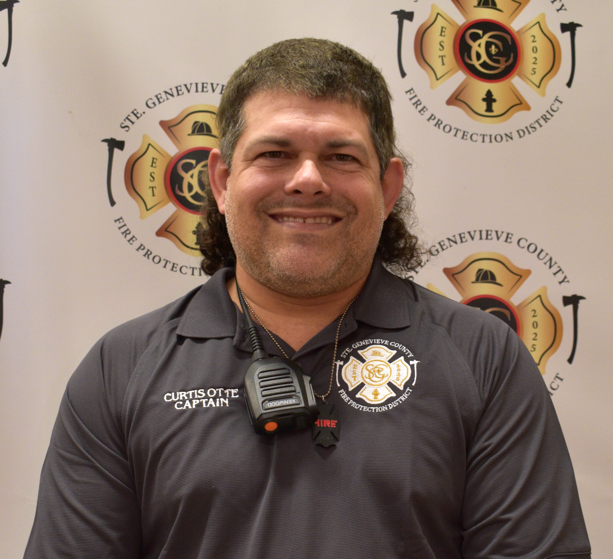 May contain: adult, male, man, person, badge, logo, symbol, face, head, and crowd