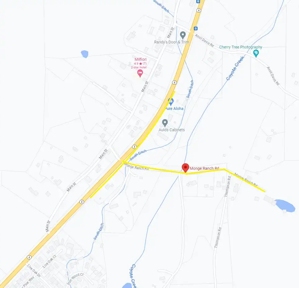 A map segment showing a highway, local businesses, and Monge Ranch Rd.