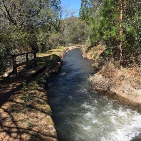 May contain: water, outdoors, nature, path, bridge, building, creek, and stream