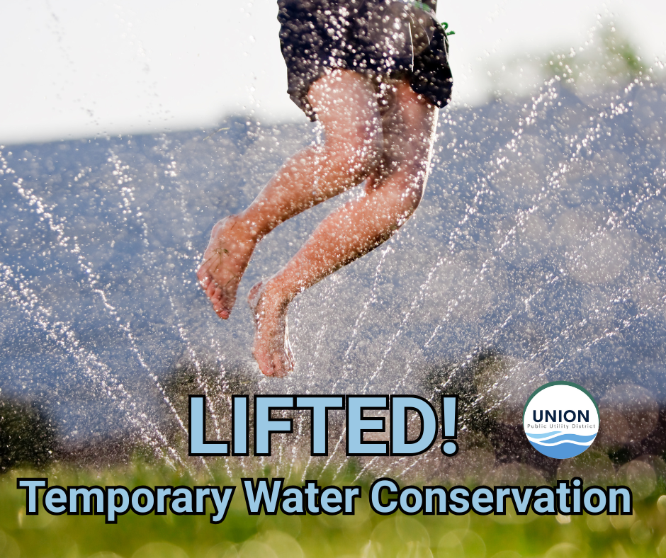 A person jumps through a sprinkler. Text: "LIFTED! Temporary Water Conservation." Union Public Utility District logo.
