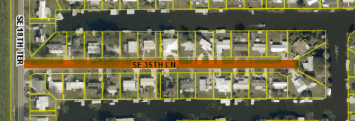 May contain: neighborhood, architecture, building, factory, water, waterfront, terminal, urban, and city