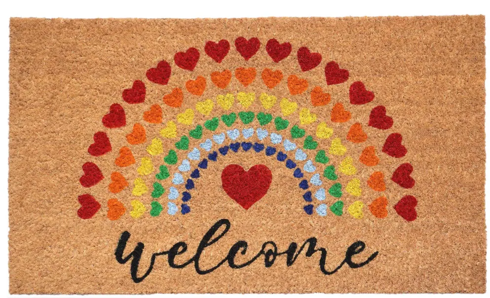 A doormat featuring a colorful rainbow of hearts and the word "welcome" in a cursive font.