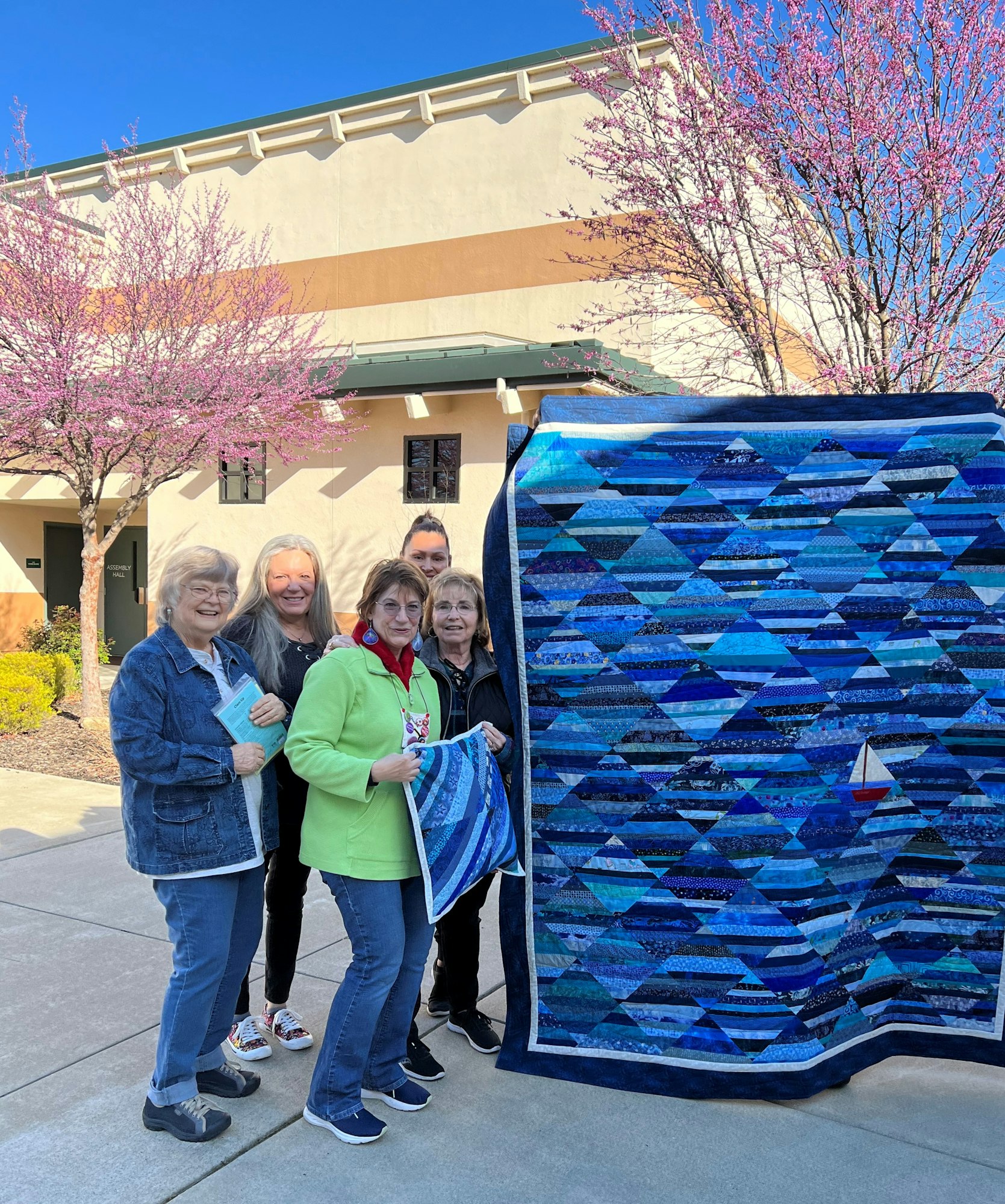 Gold Nugget Quilters Club at Cameron Park CSD with finished Multi-Colored Blue Quilt